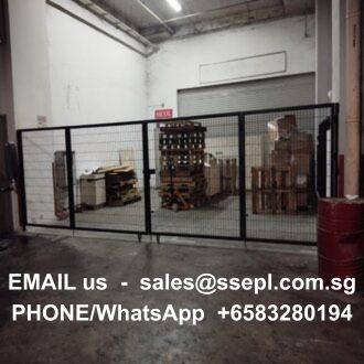 Warehouse storage area behind a black metal gate with pallets and boxes; overlaid contact text for email and phone number.