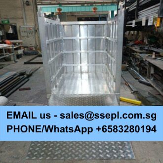 Galvanized metal enclosure/cage on a workshop floor with a blue banner displaying contact email and a phone/WhatsApp number.