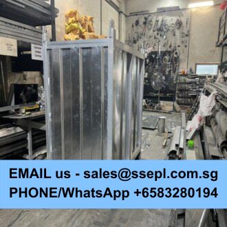 Industrial workshop with a large metal frame being built; blue banner at bottom displays contact email and WhatsApp/phone number for sales.